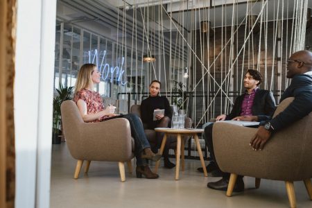 Office workers having a meeting in lobby